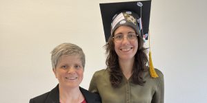 Tatjana Scheffler & Hannah Seemann, looking very happy. Hannah is wearing a PhD cap